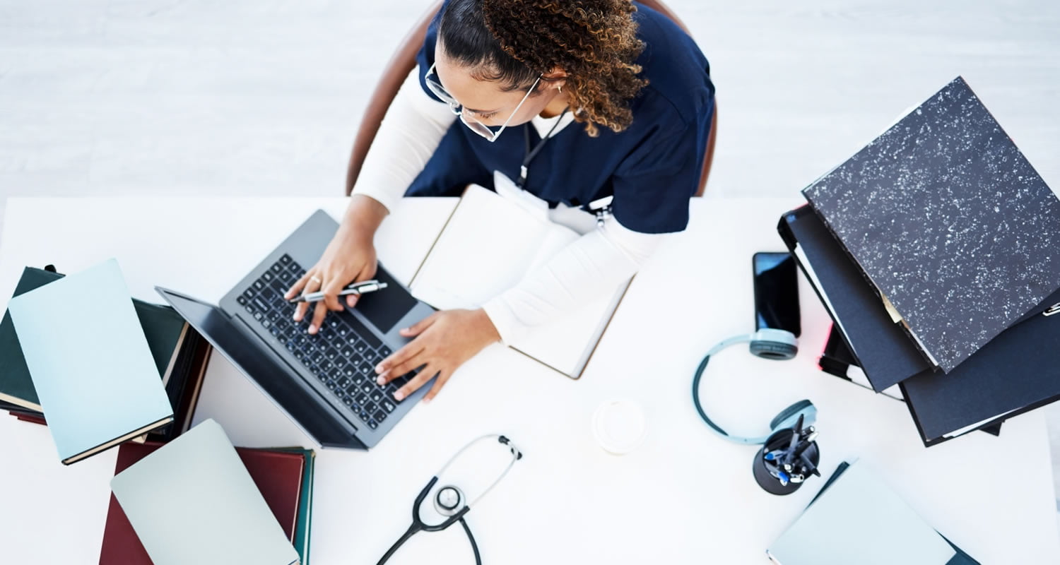 Top view, laptop or nurse in hospital research, education studying or university books learning for medical student.